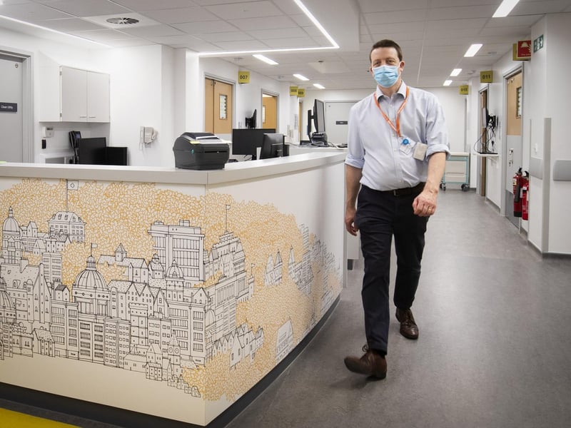 Consultant Dr Paul Leonard walks through the new reception area in the Emergency Department.
