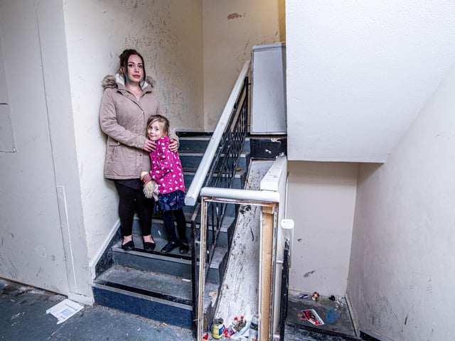 Leah Hardwick with her daughter, Ayra 5, inside Windsor House which is in a dire state. Picture: Habibur Rahman