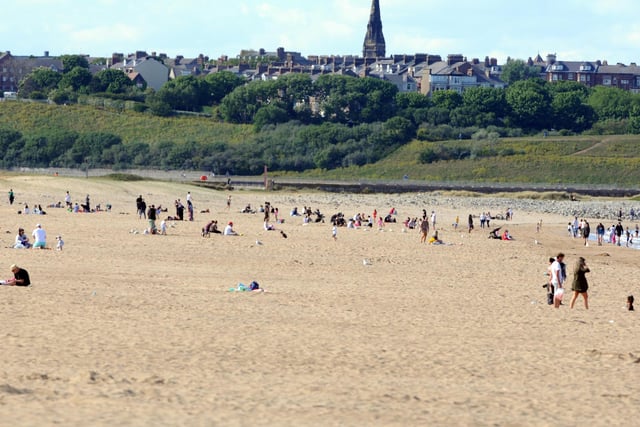 Plenty of space on the beach as people enjoy the warm weather.