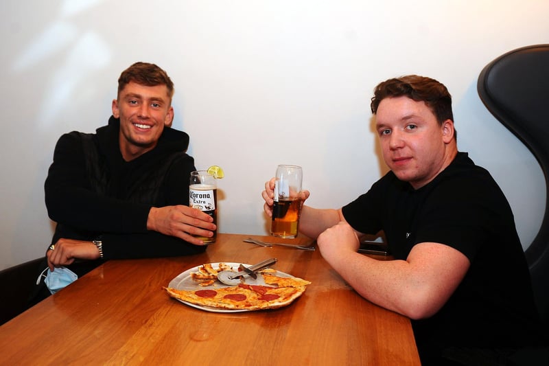 Pint and a pizza at Behind The Wall  for Reece Summerville 23, Denny and Marcus Marr 22. Denny. (Pic: Michael Gillen)