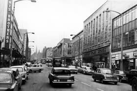 The Moor, Sheffield, showing Robert Brothers Department Store, Rockingham House, British Home Stores and Paulden's in February 1966