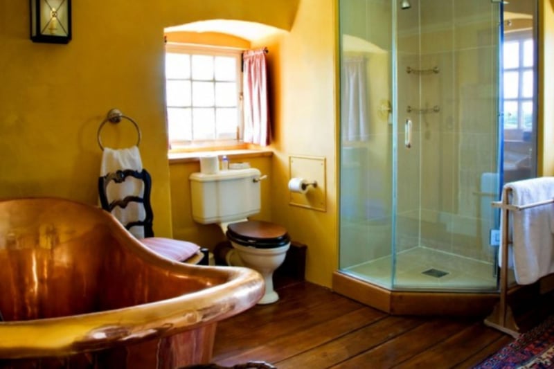 One of the bathrooms includes a beautiful French copper bath that's big enough to swim in.