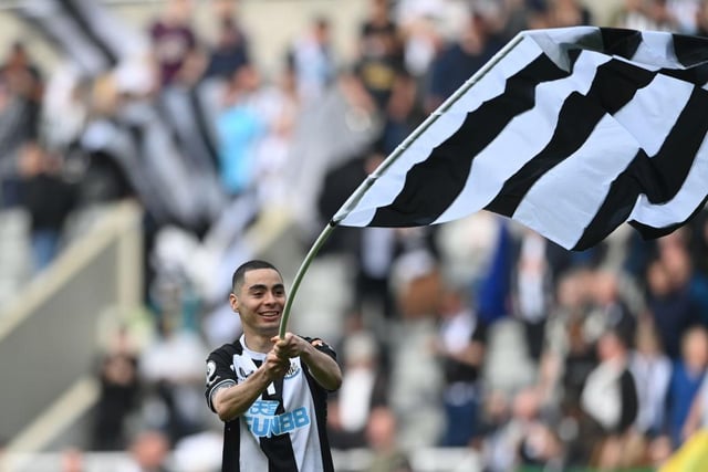 Miguel Almiron of Newcastle United waves a Newcastle United flag after their sides victory during the Premier League match between Newcastle United and Leicester City.