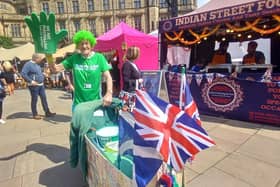 Charity fundraiser John Burkhill at Sheffield Food Festival in the city centre with his famous pram bedecked in Union flags. This weekend's event has a royal theme to celebrate the Queen's Platinum Jubilee bank holiday weekend
