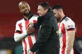 Sheffield United interim manager Paul Heckingbottom celebrates with David McGoldrick after victory over Brighton: Tim Goode/PA Wire.