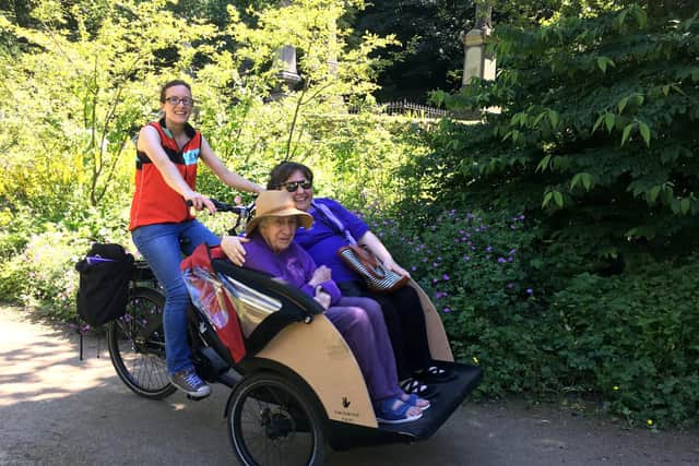 Cycling Without Age riders from a care home in the General Cemetery in 2019, with pilot Susan Gilliie 