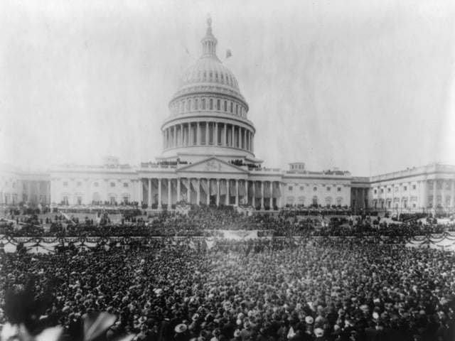 View of the large crowd gathered at the United States Capitol to witness President Woodrow Wilson's second inauguration, Washington DC, 1917.