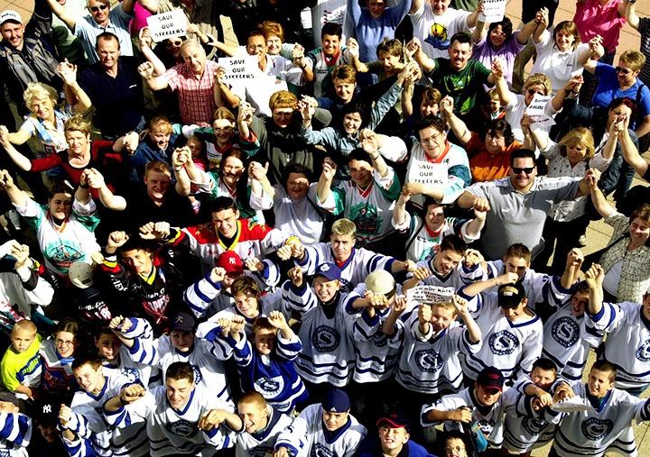 Steelers fans linking arms in a symbolic NO to the sale of their team outside the Sheffield Arena, on June 30, 2001