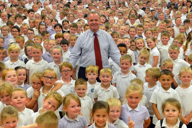Hebburn Lakes Primary School head Tony Watson is surrounded by pupils as he retires in 2019.