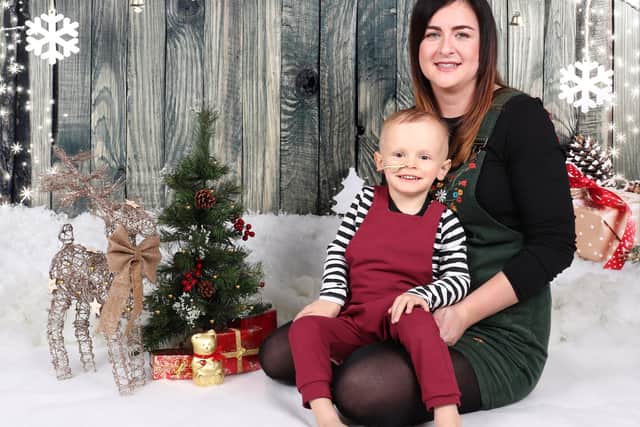 Alfie Powell and mum Emma take part in a Christmas photoshoot during his treatment