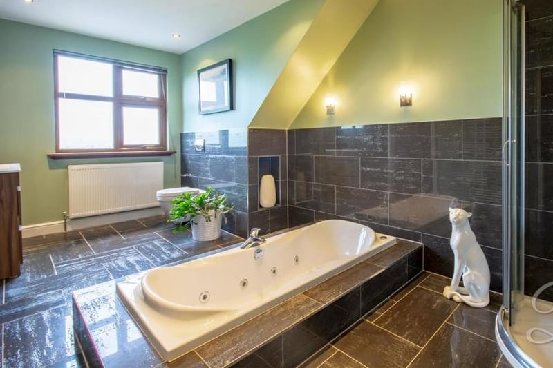 A stylish, spacious bathroom to please even the most demanding of people! Inset bath, enclosed shower, low-flush WC, wash hand basin and a window to the front.