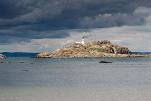 A view of a lighthouse from Yellowcraig Beach, taken by Dorota Markowska.