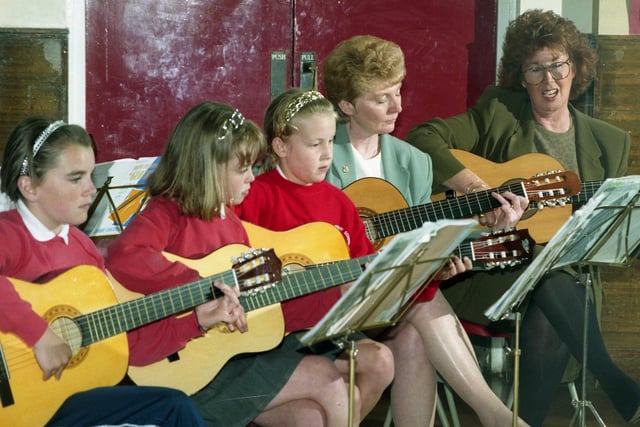 Extra curricular music teaching at Havelock Primary was described as outstanding in 1997 with pupils and teachers learning their instruments together.  Left to right are :  Amy Richardson, 10; Nikki McGuire, 11; Kimberley Moon, 10; Terry Cross, deputy head; and Jane Caldwell, head.