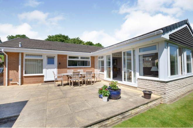 There is a large patio area at the back of the bungalow which is ideal for entertaining. The grounds are well looked after and a credit to the current owner, says the brochure.
