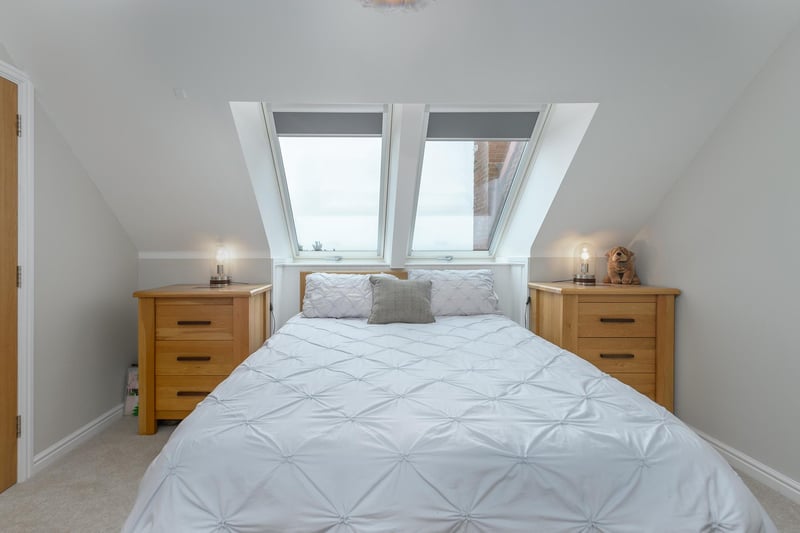 To the second floor, the property comprises two double bedrooms with large roof windows affording views of the coast, one with a fully fitted en-suite.