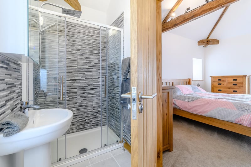 This bedroom is en-suite, complete with a walk-in shower. Another example of the very high standards at Warren Farm Stables.