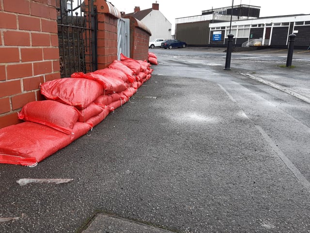 Bright red sandbags at the corner of Yarborough Terrace in Bentley, near the ambulance station