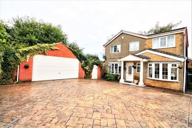 This four bedroom house has a conservatory that is half brick with double doors opening to a side garden and windows to three sides.