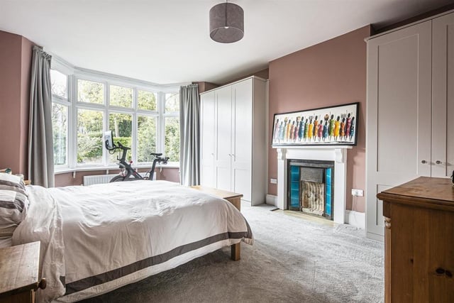 There are six double bedrooms which the sale brochure says are flexibile spaces and this room currently houses an exercise bike.