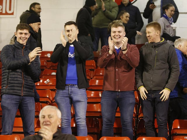 Supporters celebrate the 2-1 Leasing.com Trophy win at Walsall.