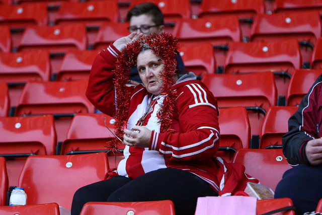 A United supporter gets into the spirit of the occasion during the festive clash with Bradford City in December 2015.