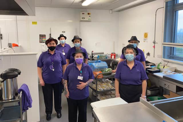 The school's kitchen staff have worked wearing masks in a hot kitchen to feed all the staff and students. Picture by Outwood Academy City