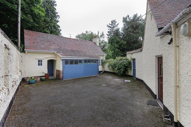 There is a double garage with attached outbuildings.