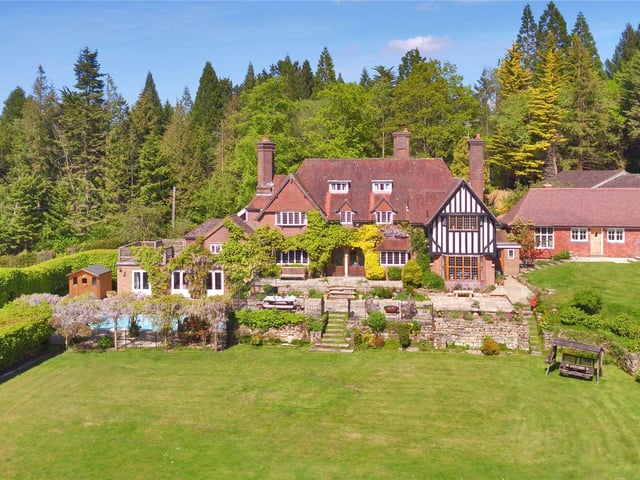 Located on the rural edge of Wadhurst, this Arts and Crafts family home sits close to a number of local amenities and offers extensive accommodation, including eight bedrooms, a guest cottage and staff studios, a swimming pool and formal gardens and woodland. Price: £2,850,000.
