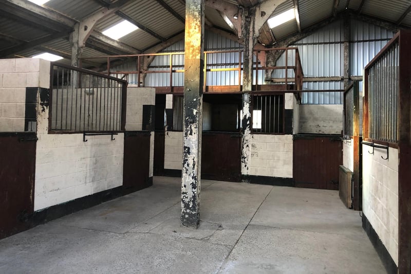 A large stable block houses ten blockwork boxes, each with water and troughs, tack room, and a mezzanine storage area for fodder. There is also a open-fronted hay store.