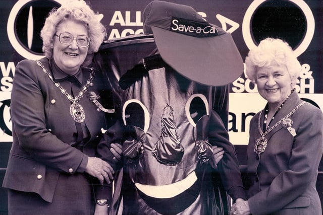 The Mayor of Fareham Dorrine Burton-Jenkins, loeft, and the Mayoress Megan Chapman with Uplands Primary School pupil Katie Gardner launching the Save-a-can initiative in May 1993. The News PP134