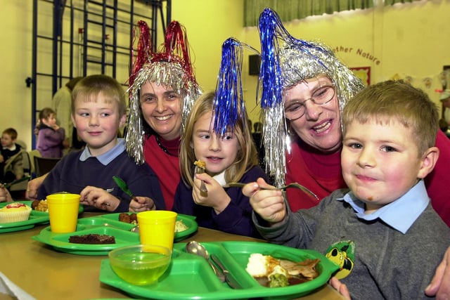 Tucking into their school meals at Hexthorpe Primary in 2003 were, from left, Keith Musson, Lauren Carr-Barker, both aged eight, and Samuel Cunneyworth, aged five. Looking on are midday supervisor Sue White and senior midday supervisor Pauline Hobson.