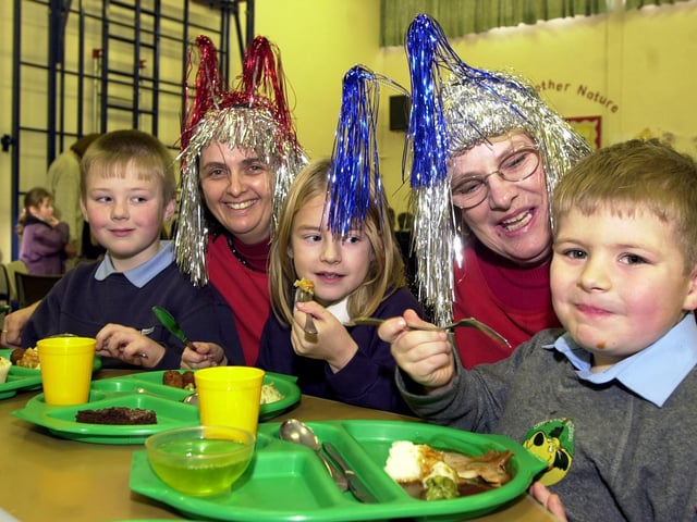 Tucking into their school meals at Hexthorpe Primary in 2003 were, from left, Keith Musson, Lauren Carr-Barker, both aged eight, and Samuel Cunneyworth, aged five. Looking on are midday supervisor Sue White and senior midday supervisor Pauline Hobson.