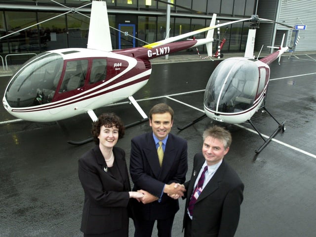 Dragon Helicopters managing director Bob Alexander (right) and director Karolyn Wellings being welcomed to Sheffield City Airport by the airport's MD Jon Horne (centre)