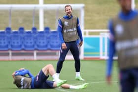 Harry Kane is all smiles during training. Photo by Catherine Ivill/Getty Images