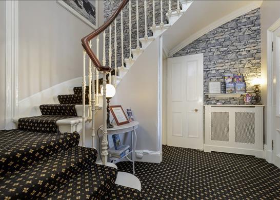 The raised ground floor has a wide entrance hall.
