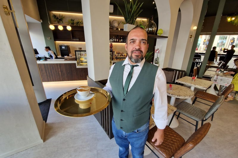 Pedro Costa serves at flat white at La Bottega which opened on Monday.