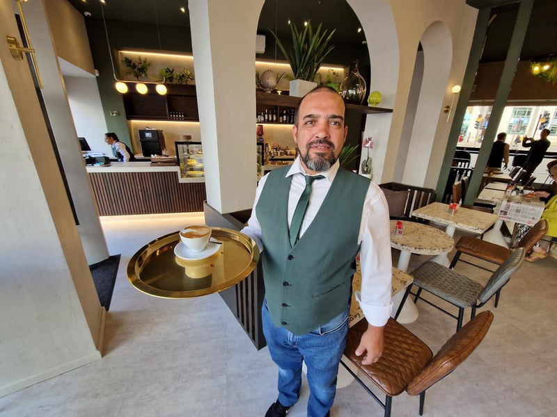 Pedro Costa serves at flat white at La Bottega which opened on Monday.
