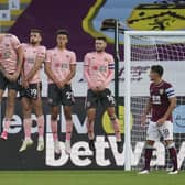 Sheffield United players rise to block a free kick from Burnley's Robbie Brady in last night's Carabao Cup match at Turf Moor (AP Photo/Jon Super, Pool)