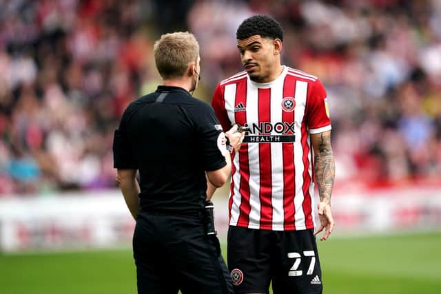 Sheffield United's Morgan Gibbs-White (right) is spoken to by referee Gavin Ward against Reading: Zac Goodwin/PA Wire.
