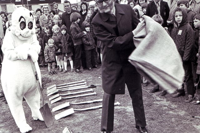 With a flourish Mr C.T. Brannigan, editor of The Star, unveils a plaque to commemorate the planting of 50 trees on East Bank Road, Sheffield, by children of the area and Gloops, March 1973
