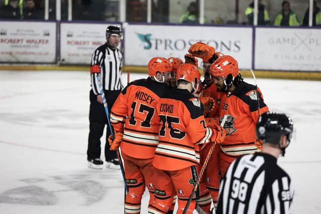 Group huddle after Steelers score at Manchester