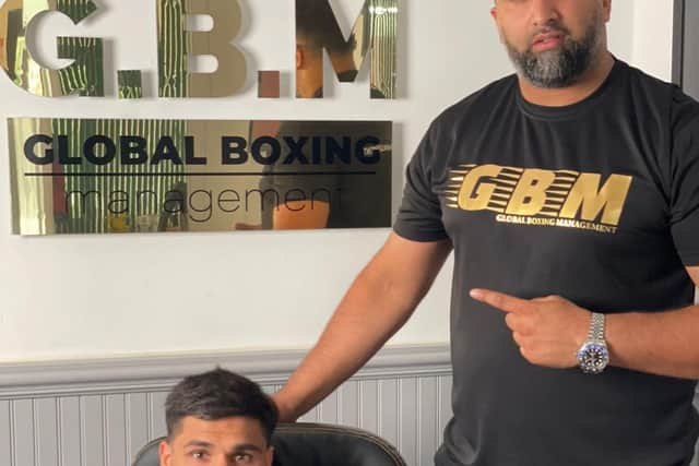 Super featherweight prospect Frak Ali (left) with his manager, former professional boxer Izzy Asif.