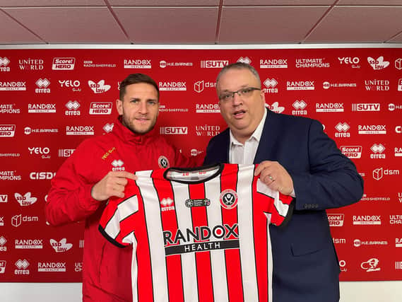 Billy Sharp presents the charity CEO with the first tribute shirt