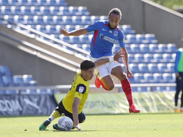 Marcuss Harness skips past Alex Gorrin of Oxford United during the first half