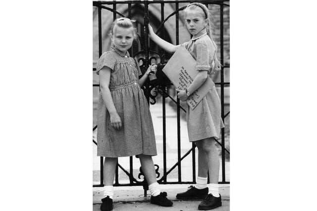 Schoolgirls at the gates of the Royal Garrison Church in Old Portsmouth.