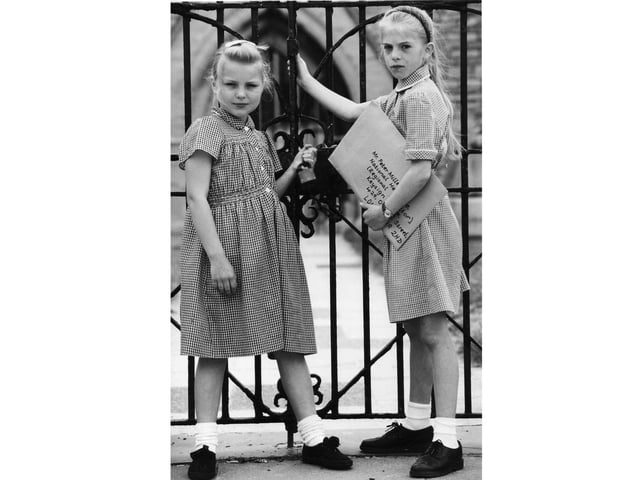 Schoolgirls at the gates of the Royal Garrison Church in Old Portsmouth.