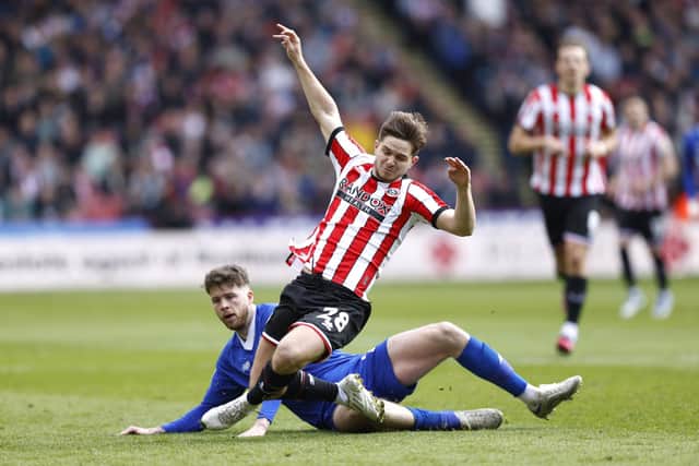 Cardiff City's Jack Simpson (left) and Sheffield United's James McAtee battle for the ball during the Sky Bet Championship match at Bramall Lane, Sheffield: Richard Sellers/PA Wire.