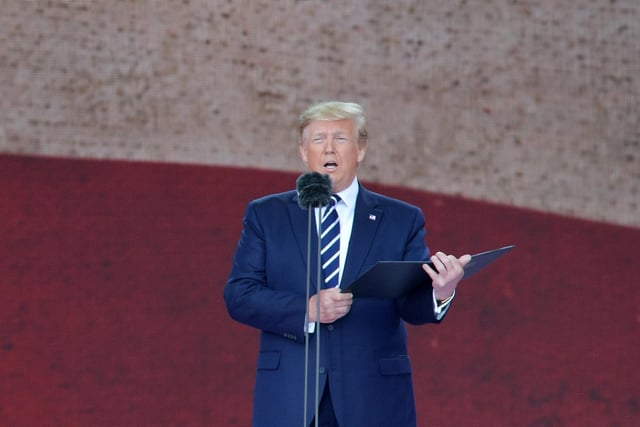 US President Donald Trump stands and speaks during the event. Picture: DANIEL LEAL-OLIVAS/AFP/Getty Images