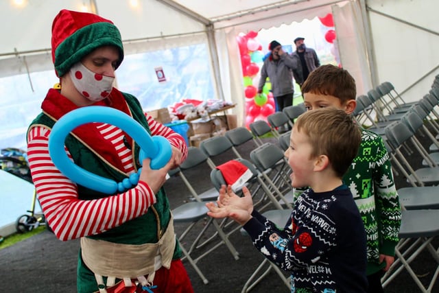 The children's party, which kicked off the Winter Festival, included lessons on how to make weird and wonderful shapes with balloons. This lad was amazed!