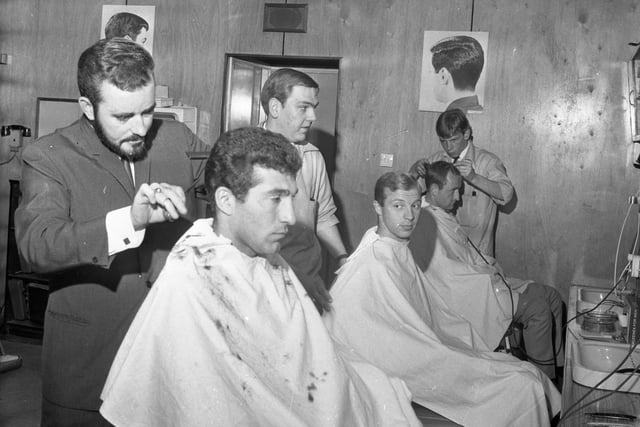 The Russian football team  having hair cuts from Durham City hairdresser Jack Brown in 1966.